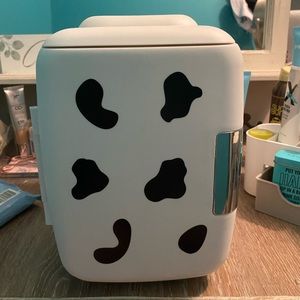 almost brand new cow print skin/mini fridge